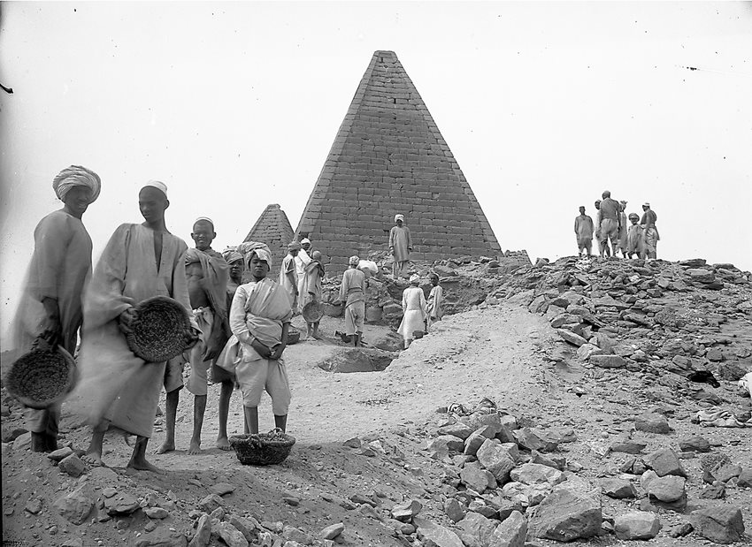 Ibrahim directed this portrait of workers at the Gebel Barkal Pyramid 3 in February 1916, which has become one of his most recognized photographs, in part due to the scarcity of photographs that focus on the people who carried out the actual digging with pickaxes, shovels, trowels and shoulder-borne basket after shoulder-borne basket of sand and stones. 