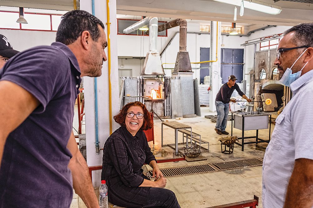 Assad Dghim, at left, whom Keskes taught in 1987, chats with Keskes at the Tunis Institute of Fine Arts at Nabeul, where Dghim is the trainer in glassmaking and where Keskes herself once taught. “Glassmaking with Sadika was about passion and beauty,” Dghim says. 