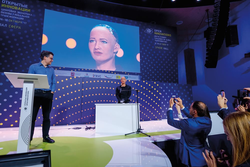 From the imagination of visionary inventors centuries ago to today's ai: Humanoid robot Sophia takes the stage to answer questions next to her creator, David Hanson, founder and CEO of Hanson Robotics, at the Moscow Innovative Development “Open Innovations 2017” conference. A few days later, Sophia became the first robot to be granted a national citizenship—by Saudi Arabia. She uses digital neural networking and conversational language processing to simulate human behavior and response.