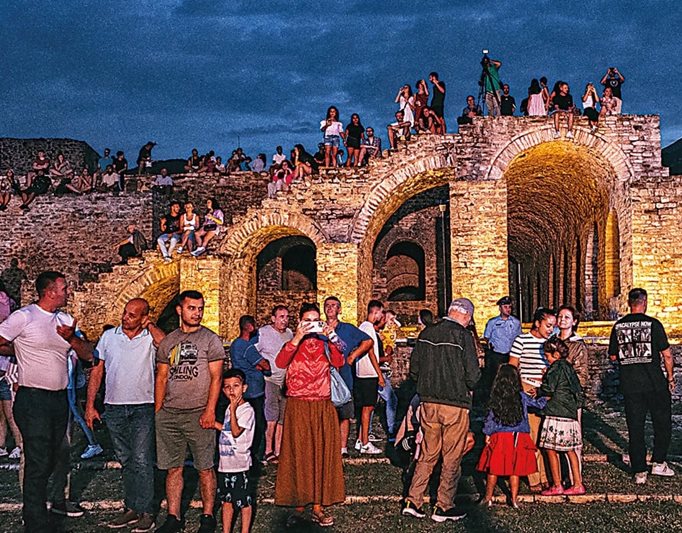 Visitors to the folklore festival use the old stones as perches to get a view of the action on stage during the opening performances at dusk. The city of Gjirokastër’s name is derived from the Albanian word “kala,” meaning “castle,” and it is home to a 13th-century fortress that sits atop a hill overlooking the city.